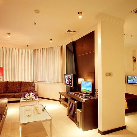 Dalian San Jiang Business Hotel Kamer foto